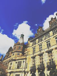 Low angle view of buildings against blue sky