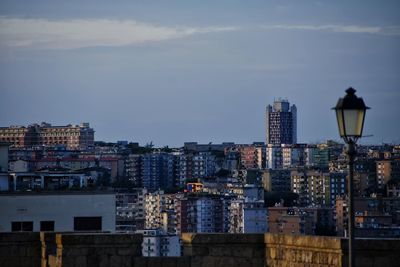 Buildings in city at dusk