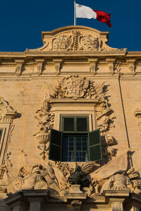 Low angle view of building facade against clear sky