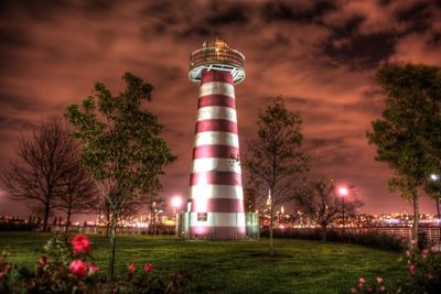 Silhouette of tower against cloudy sky