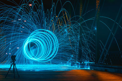 Full length of illuminated light trails at night