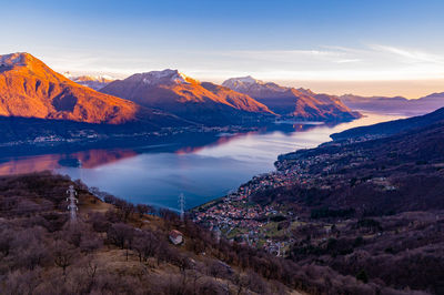 View of lake como, towards the south, from musso, with the mountains above and the towns.