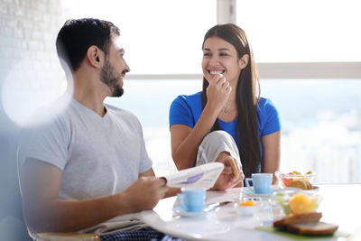 Young man and woman having food