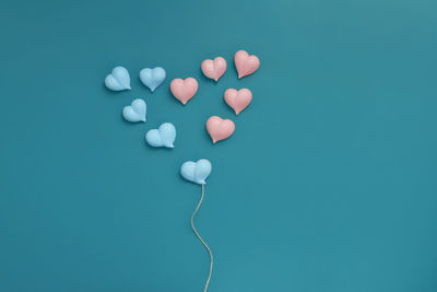 High angle view of heart shape against blue background