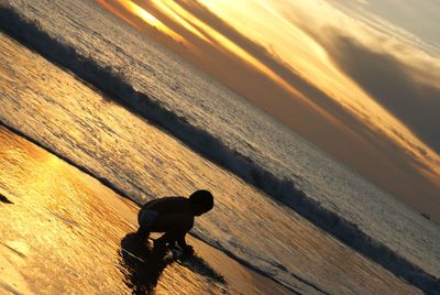 High angle view of sea against sky during sunset