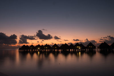 Scenic view of silhouette building against sky during sunset