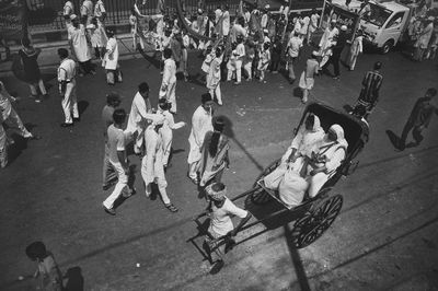 High angle view of people on street in city