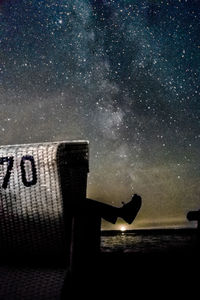 Digital composite image of text on sea at night