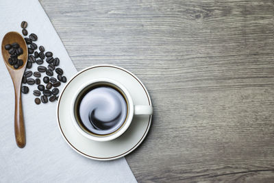 High angle view of coffee cup on table