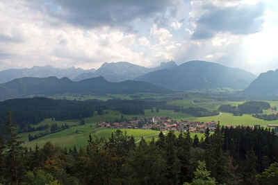 Scenic view of landscape and mountains against sky