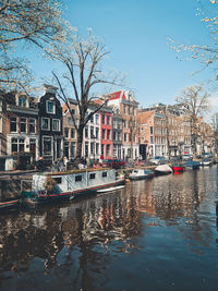 Boats in canal in city