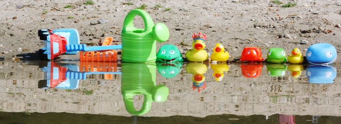 Multi colored toys on beach