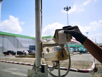 Close-up of machine against sky