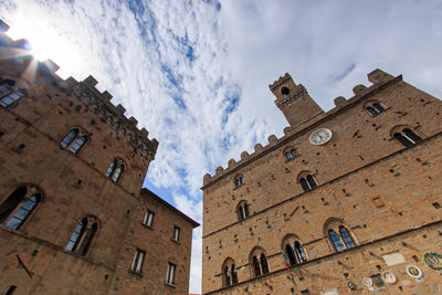 Low angle view of historic building against cloudy sky