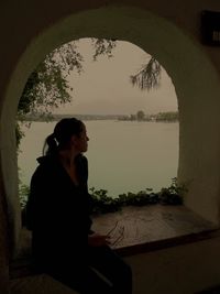 Man sitting by window