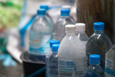 Close-up of plastic water bottles on table