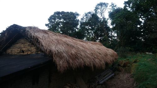 Low angle view of house on field against sky