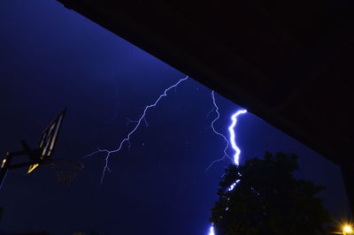 Low angle view of lightning in sky at night