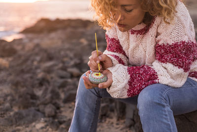 Full length of girl sitting at beach