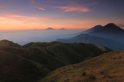 Scenic view of mountains against sky during sunset