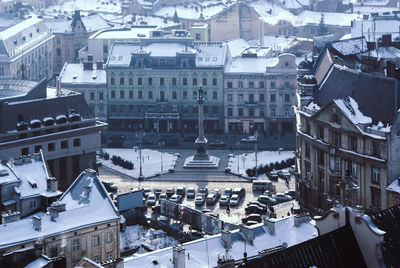 High angle view of buildings in city during winter