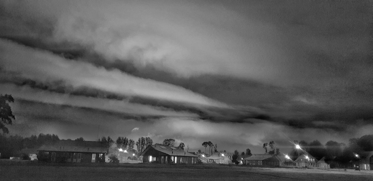 black and white, cloud, darkness, monochrome, sky, monochrome photography, environment, nature, storm, landscape, thunder, land, panoramic, tree, night, outdoors, plant, beauty in nature, architecture, group of people