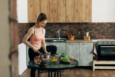 Sports woman cooking healthy eat at home