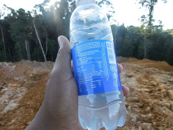 Close-up of hand holding drinking glass