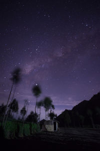 Scenic view of field against sky at night