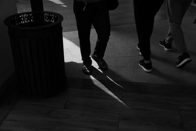 Low section of people standing on floor