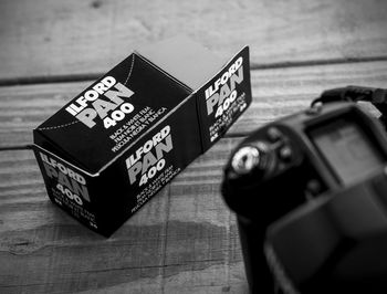 Close-up of camera and box on table