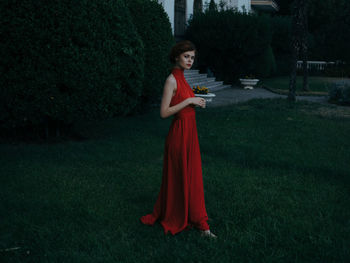 Young woman standing on field