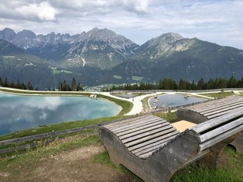 Scenic view of lake and mountains against sky