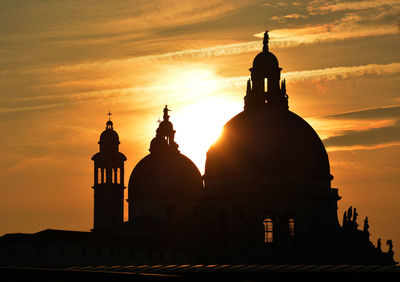 High section of building against sky at sunset