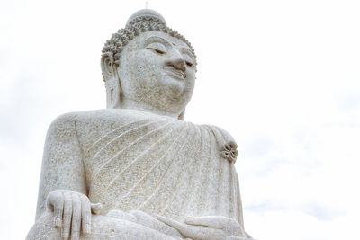 Low angle view of statue against sky