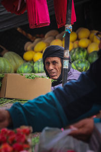 An old moroccan seller in a market village.