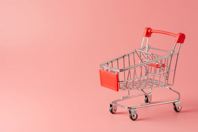 Close-up of crane against red background
