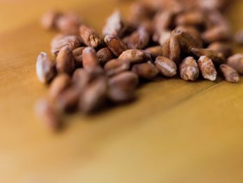 Close-up of coffee beans on table