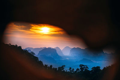 Scenic view of silhouette mountains against sky during sunset