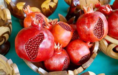 Heap of wooden pomegranate ornaments for sale at the vernissage market in yerevan, armenia