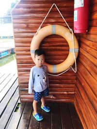 Portrait of boy on wood