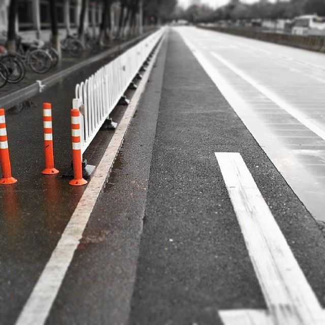 the way forward, diminishing perspective, transportation, road marking, vanishing point, road, surface level, asphalt, empty, long, street, direction, no people, guidance, in a row, absence, outdoors, day, arrow symbol, empty road