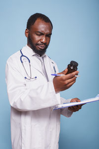 Portrait of young woman using mobile phone