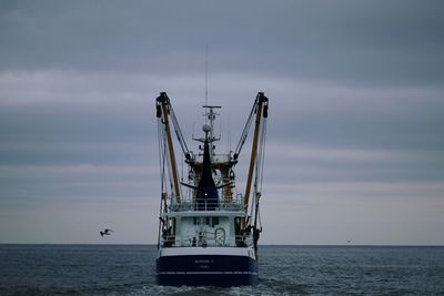 Ship in sea against sky