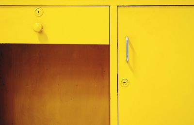 Close-up of yellow table and locker