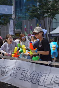 Group of people at market stall