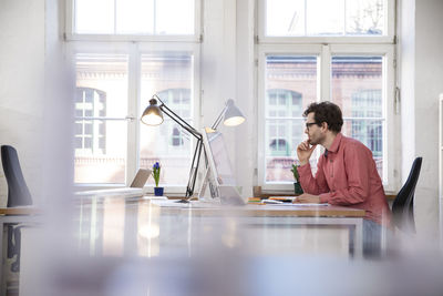 Man sitting at desk in office