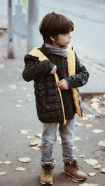 Full length of cute boy standing on street