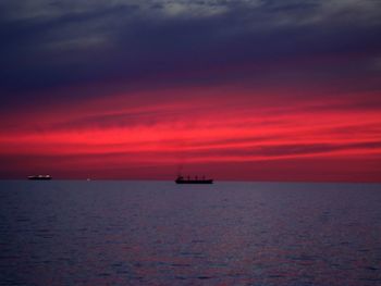 Scenic view of sea against orange sky