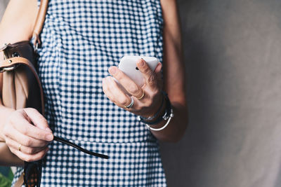 Midsection of woman holding hands